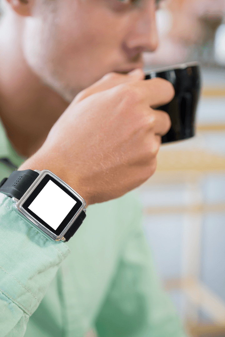 Man Drinking Coffee Wearing Transparent Smart Watch