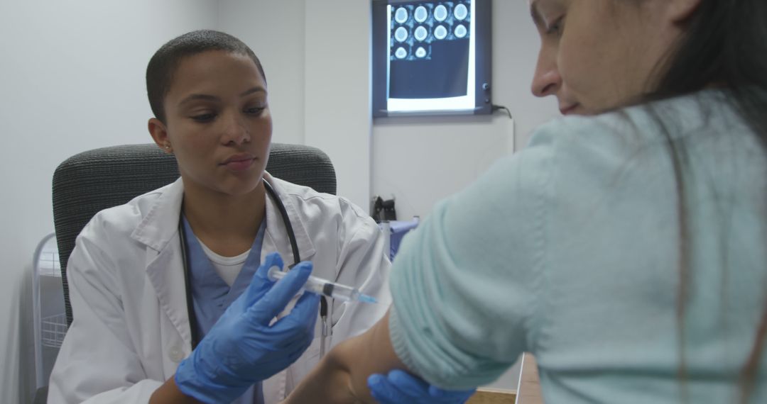 Doctor Administering Vaccine to Patient in Clinic - Free Images, Stock Photos and Pictures on Pikwizard.com