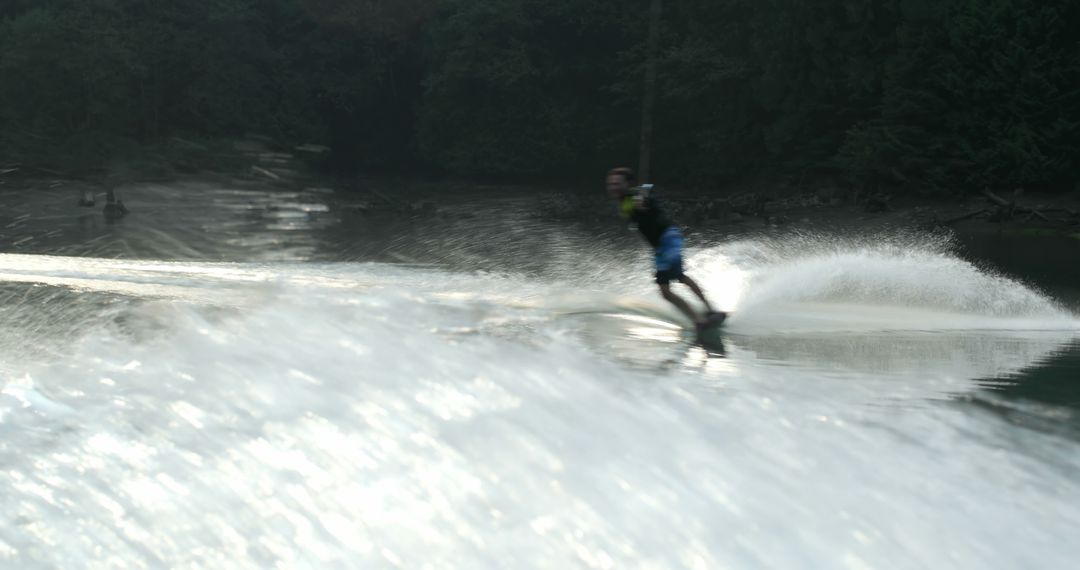 Person Wakeboarding on Lake Creating Spray - Free Images, Stock Photos and Pictures on Pikwizard.com