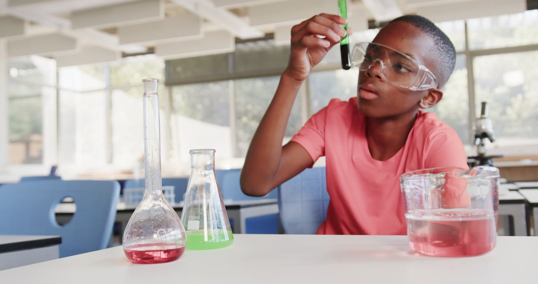 Young Boy Conducting Science Experiment in School Laboratory