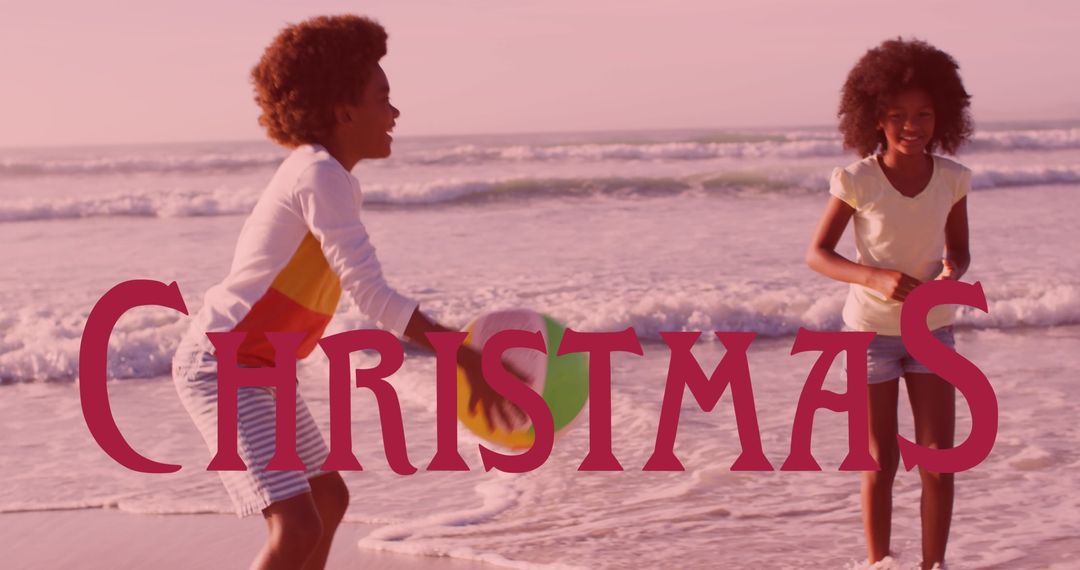 Siblings Playing with Beach Ball During Christmas at Sandy Beach