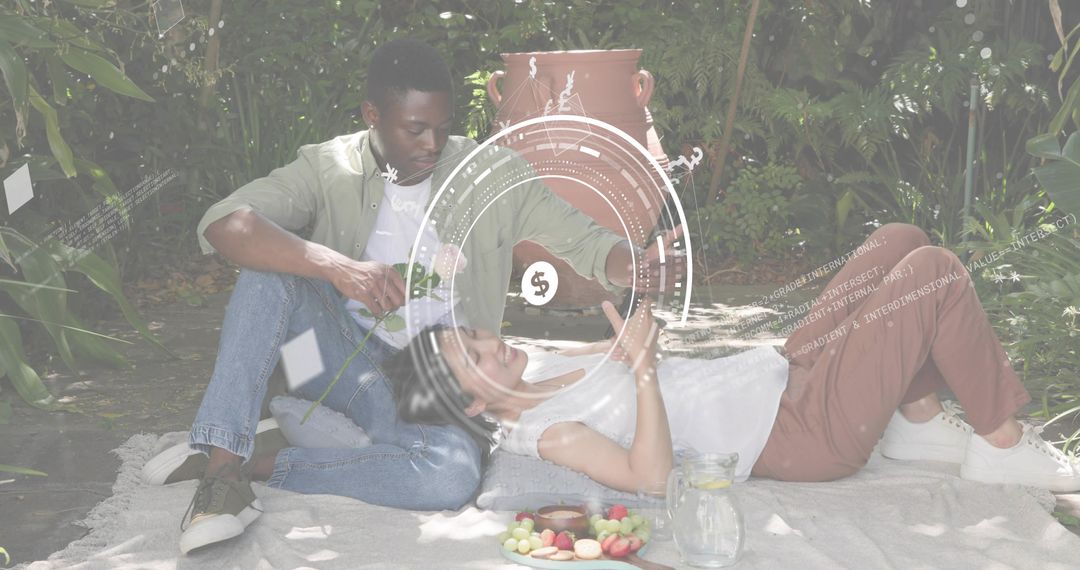 Couple Relaxing on Picnic Blanket in Backyard with Futuristic HUD Overlay and Refreshments
