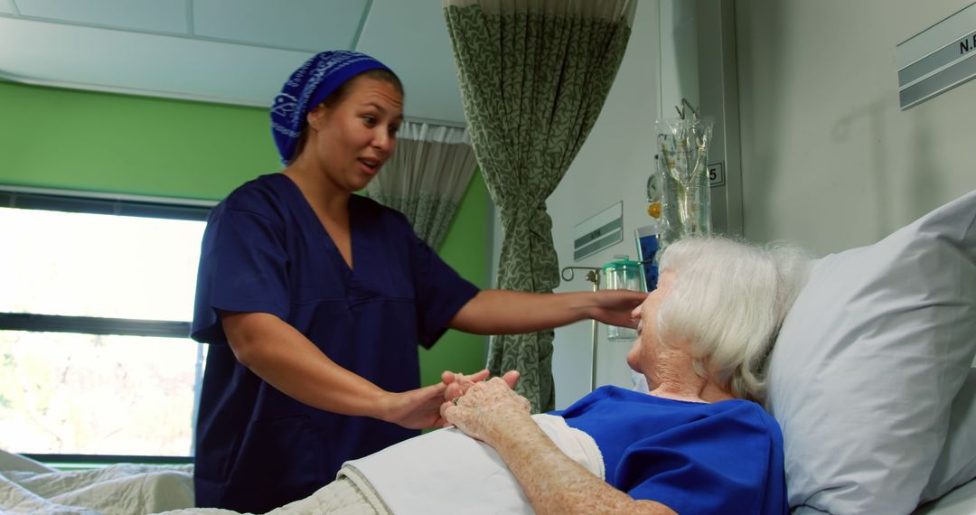 African American Nurse Consoling Senior Patient in Hospital Ward - Free Images, Stock Photos and Pictures on Pikwizard.com