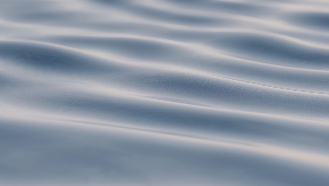 Gliding Silvery-Blue Water Ripples Creating Diagonal Parallel Wavelets for Calm Abstract Background
