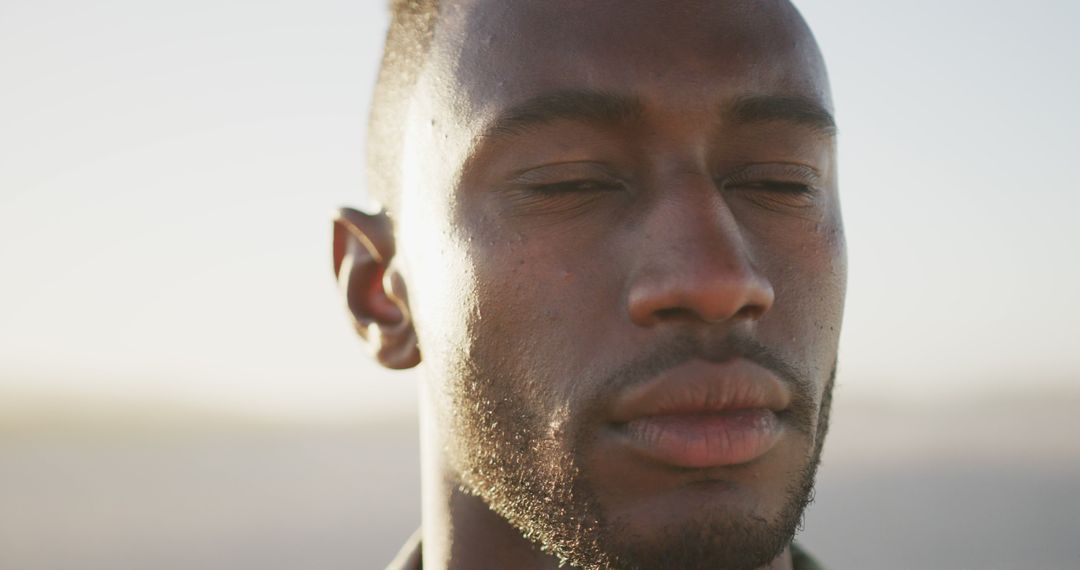 Serene Young African American Man With Closed Eyes in Contemplation - Free Images, Stock Photos and Pictures on Pikwizard.com