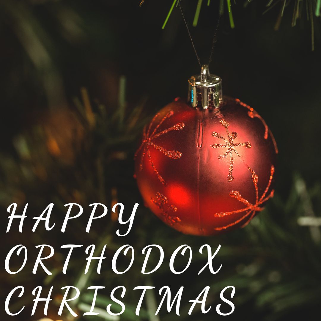 Red Christmas Ornament on Pine Tree Celebrating Orthodox Christmas