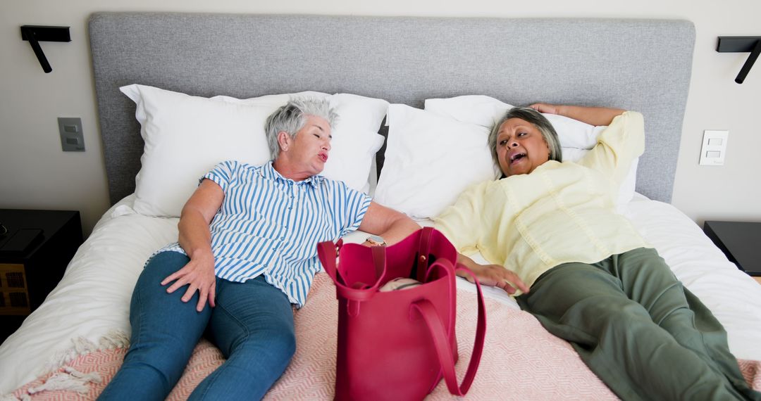 Senior Couple Relaxing and Talking on Bed for Leisure Time