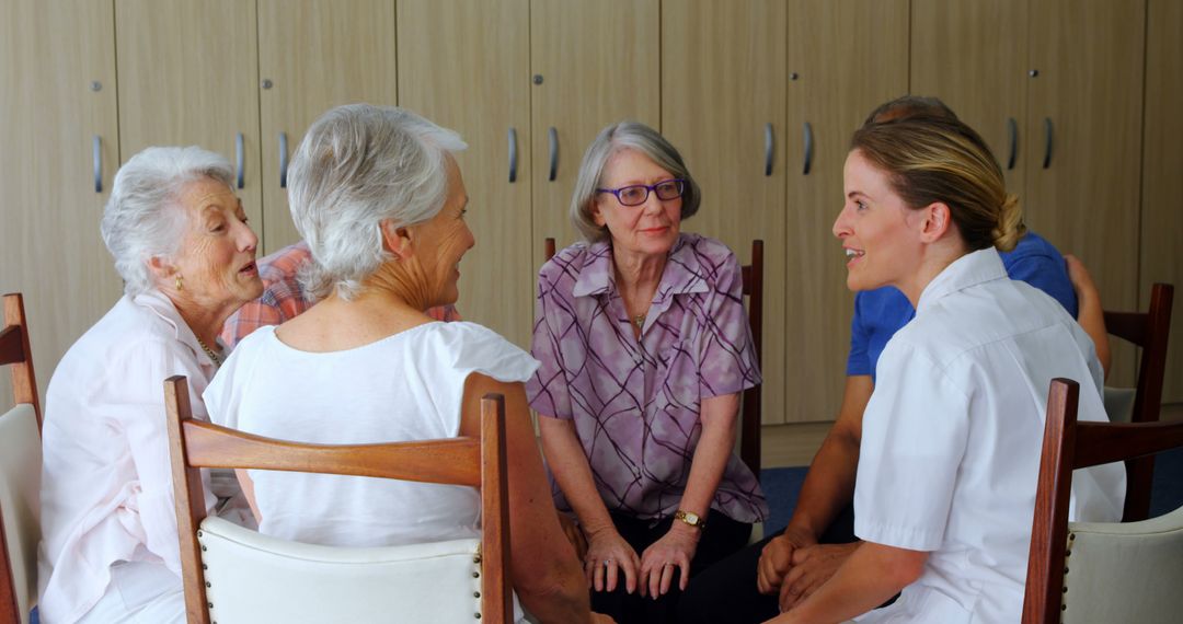 Seniors Engaging in Group Discussion with Caregiver at Nursing Home - Free Images, Stock Photos and Pictures on Pikwizard.com