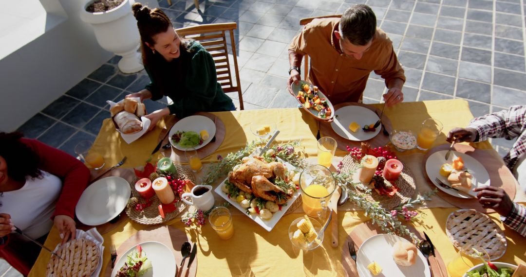 Group of friends enjoying outdoor thanksgiving meal together - Free Images, Stock Photos and Pictures on Pikwizard.com