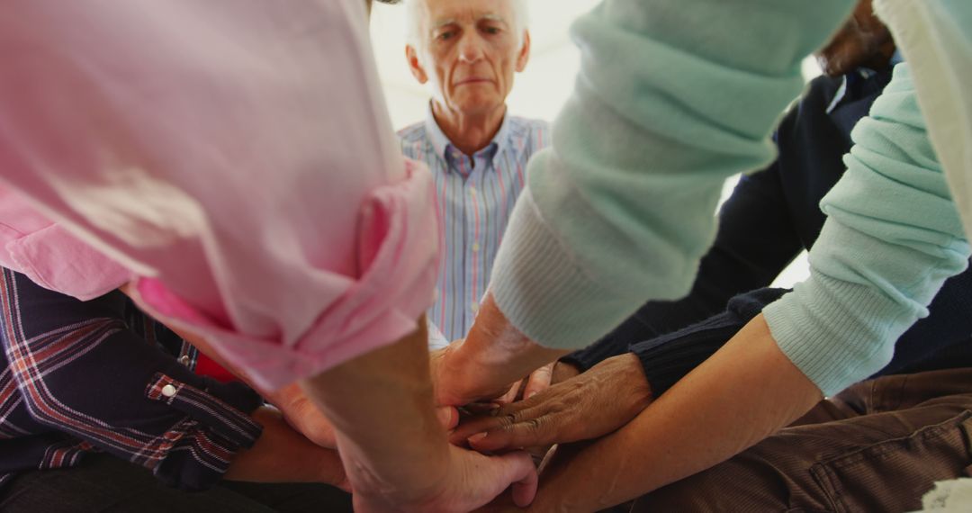 Group of Diverse Seniors Joining Hands in Unity - Free Images, Stock Photos and Pictures on Pikwizard.com