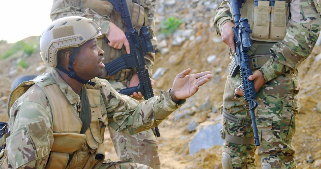 Soldiers in Camo Gear Strategizing in Field - Free Images, Stock Photos and Pictures on Pikwizard.com