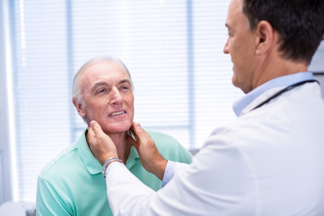 Doctor examining senior patients neck - Free Images, Stock Photos and Pictures on Pikwizard.com