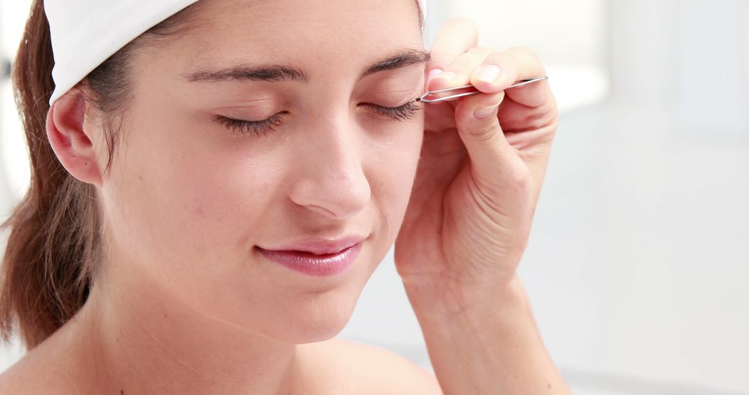 Woman Getting Eyebrows Plucked in Beauty Routine - Free Images, Stock Photos and Pictures on Pikwizard.com