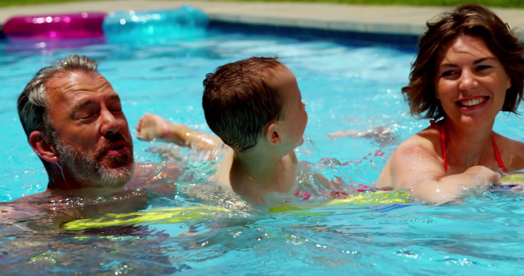 Happy Family Having Fun Swimming in Pool on Sunny Day - Free Images, Stock Photos and Pictures on Pikwizard.com