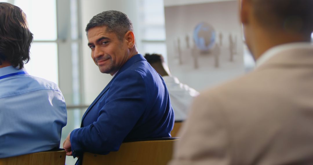 Caucasian Businessman Smiling at Seminar Back View
