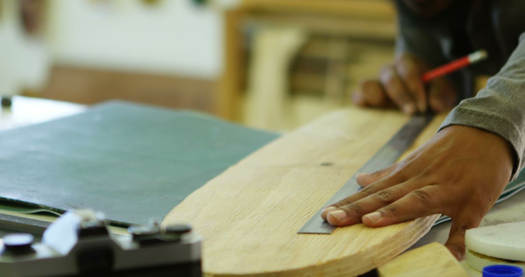 Craftsman Marking Wood Board with Precision and Skill - Free Images, Stock Photos and Pictures on Pikwizard.com