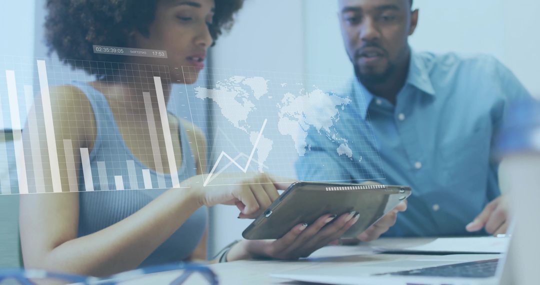 Diverse Business Team Analyzing Digital Charts and Global Data