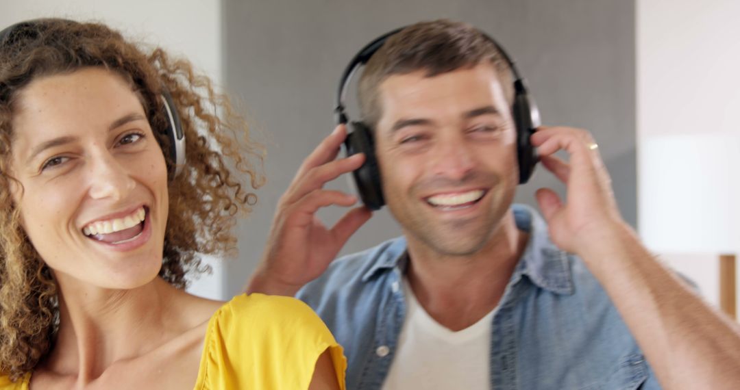 Joyful Couple Enjoying Music Together at Home
