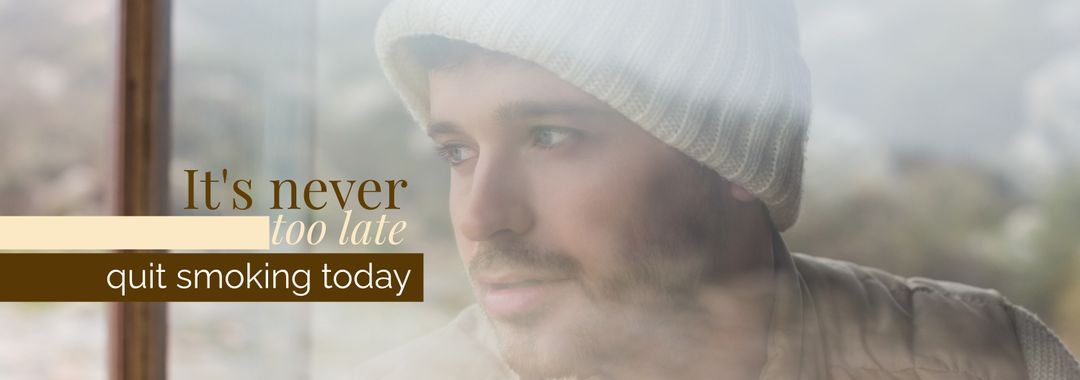 Hopeful man contemplating life changes near window