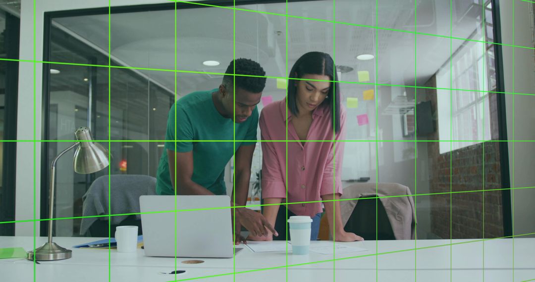 Colleagues Collaborating in Modern Office on Innovative Project