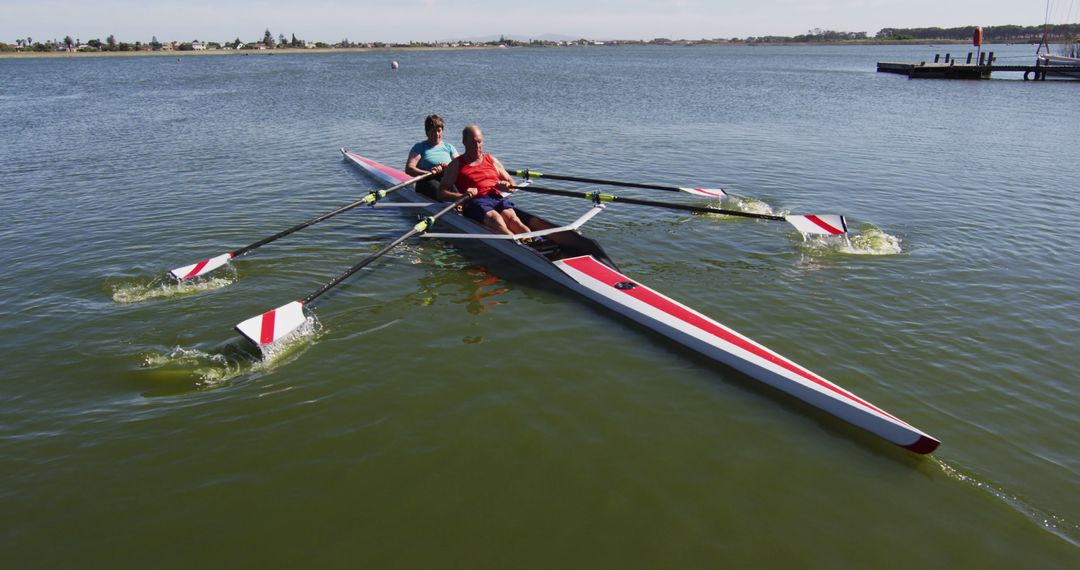 Two Men Rowing in Double Scull on Calm Lake - Free Images, Stock Photos and Pictures on Pikwizard.com