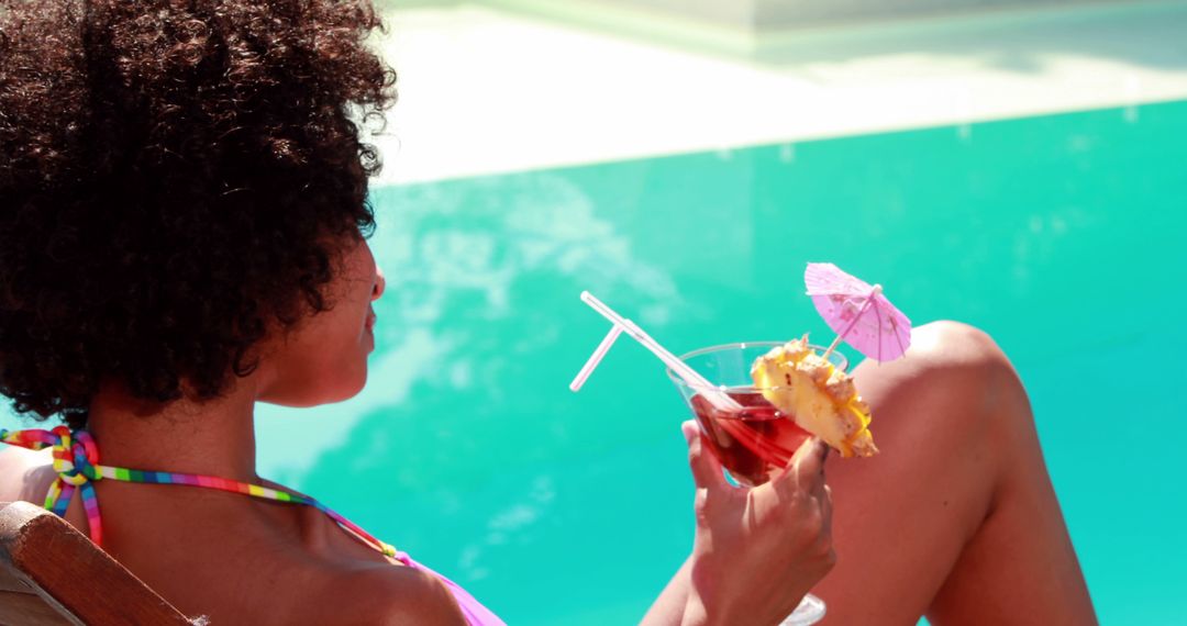 Woman Relaxing by Poolside Holding Tropical Cocktail - Free Images, Stock Photos and Pictures on Pikwizard.com