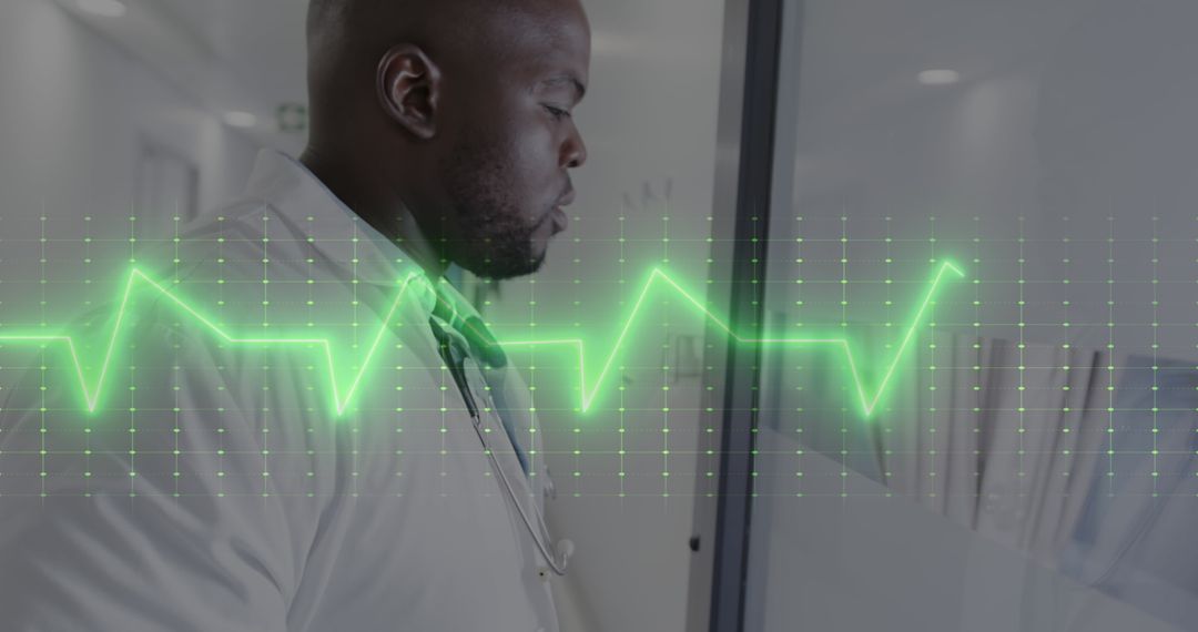 African American Doctor Analyzing Digital Heart Sensor Data