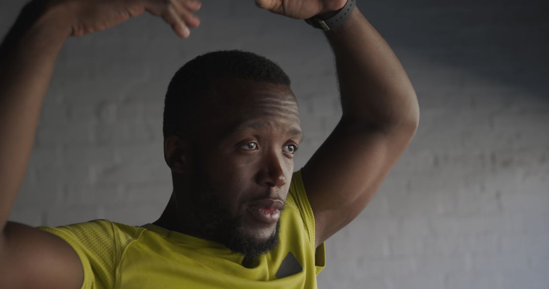 Focused African-American man exercising indoors - Free Images, Stock Photos and Pictures on Pikwizard.com