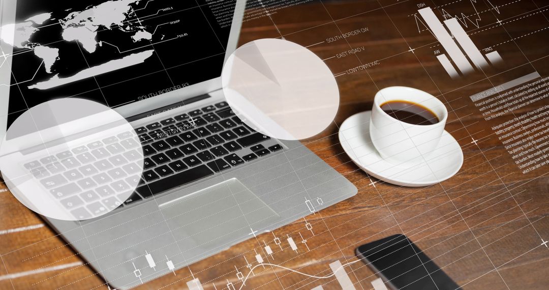 Modern Workspace with Laptop and Coffee Amid Data Charts