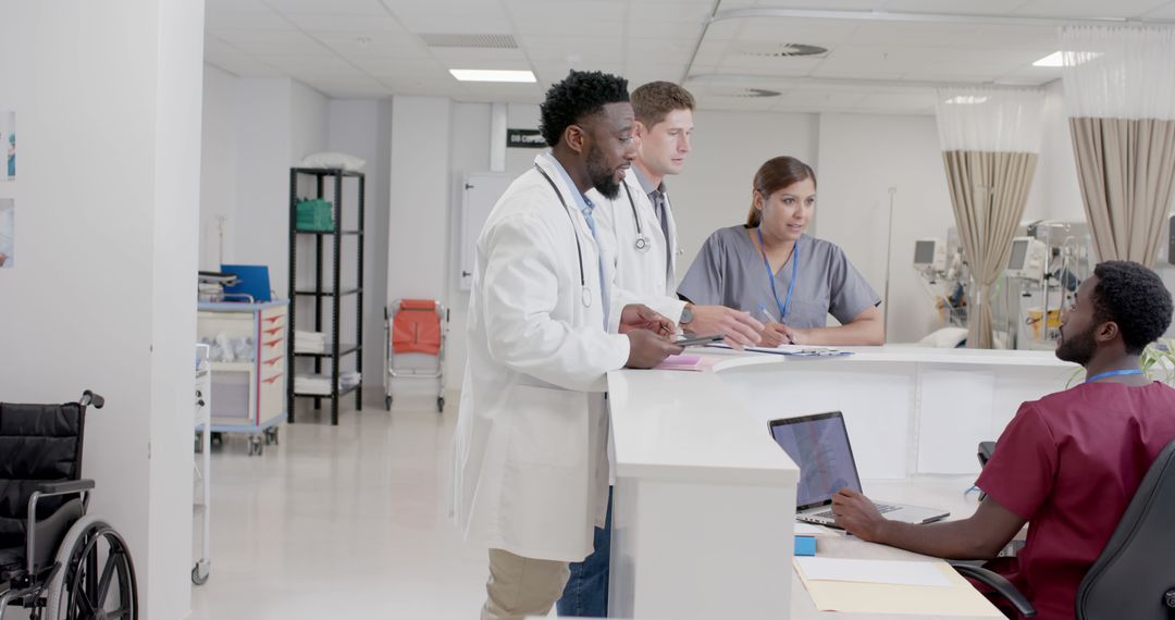 Medical Professionals Discussing in a Modern Hospital Room - Free Images, Stock Photos and Pictures on Pikwizard.com