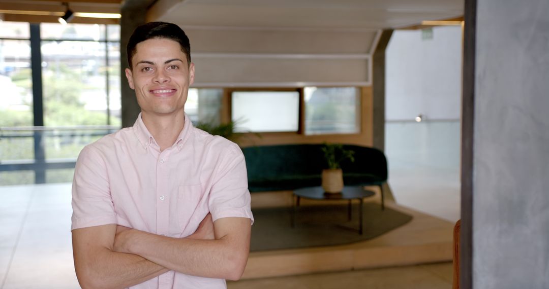 Smiling Professional Man in Modern Office Lobby
