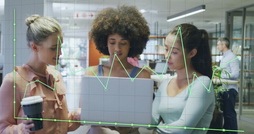 Diverse Business Team Analyzing Data on Laptop in Modern Office