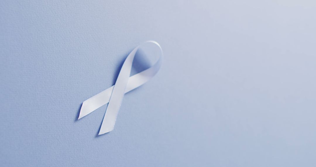 White Ribbon for Awareness and Support on Light Blue Background - Free Images, Stock Photos and Pictures on Pikwizard.com
