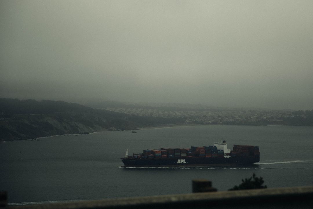 Container Ship Sailing Through Foggy Waters - Free Images, Stock Photos and Pictures on Pikwizard.com