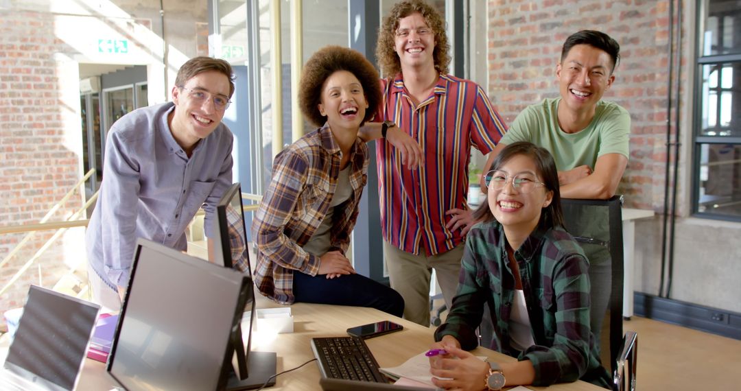 Diverse Team Collaborating and Smiling in Modern Office - Free Images, Stock Photos and Pictures on Pikwizard.com