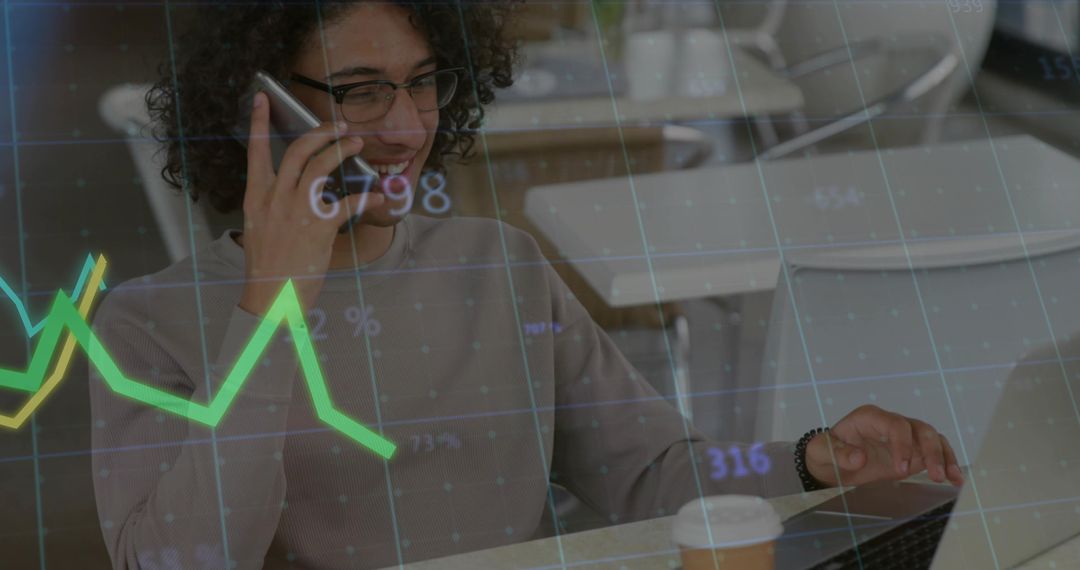 Business Professional Analyzing Data on Laptop with Smartphone