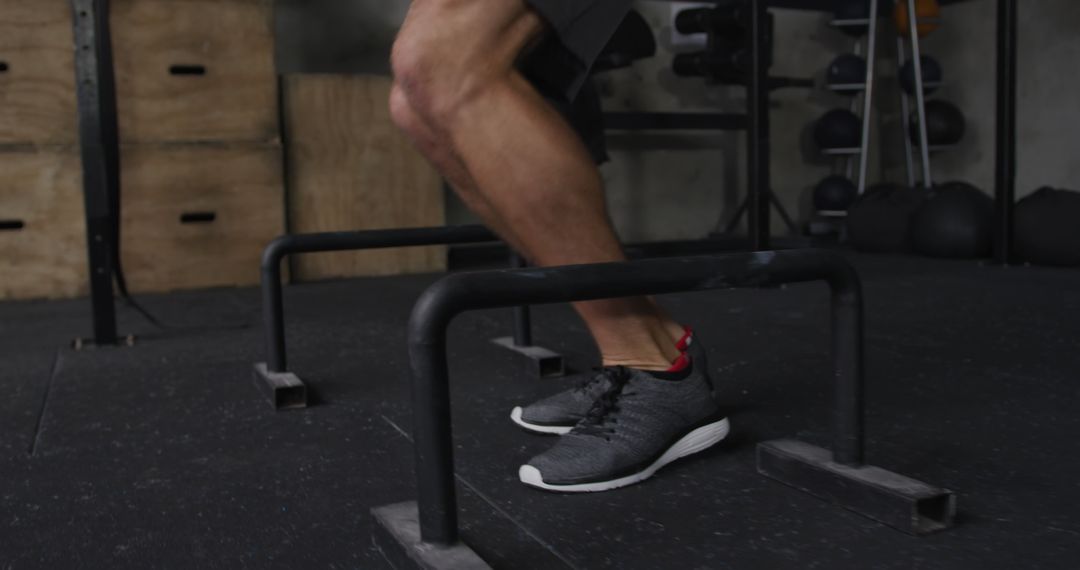 Man Exercising with Hurdles in Fitness Gym for Cross Training Workout