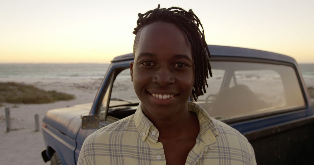 Smiling Young Man with Vintage Truck at Sunset Beach - Free Images, Stock Photos and Pictures on Pikwizard.com