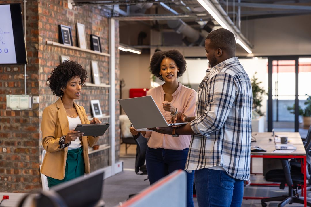 Diverse Team Collaborating in Modern Office with Exposed Brick