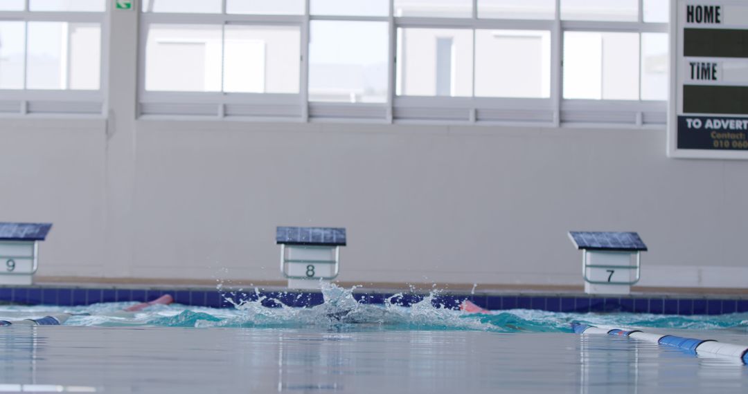 Empty Indoor Swimming Pool with Time Board in Background - Free Images, Stock Photos and Pictures on Pikwizard.com