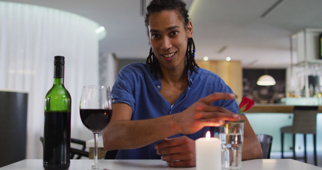 Man Enjoying Romantic Dinner with Wine and Candlelight - Free Images, Stock Photos and Pictures on Pikwizard.com