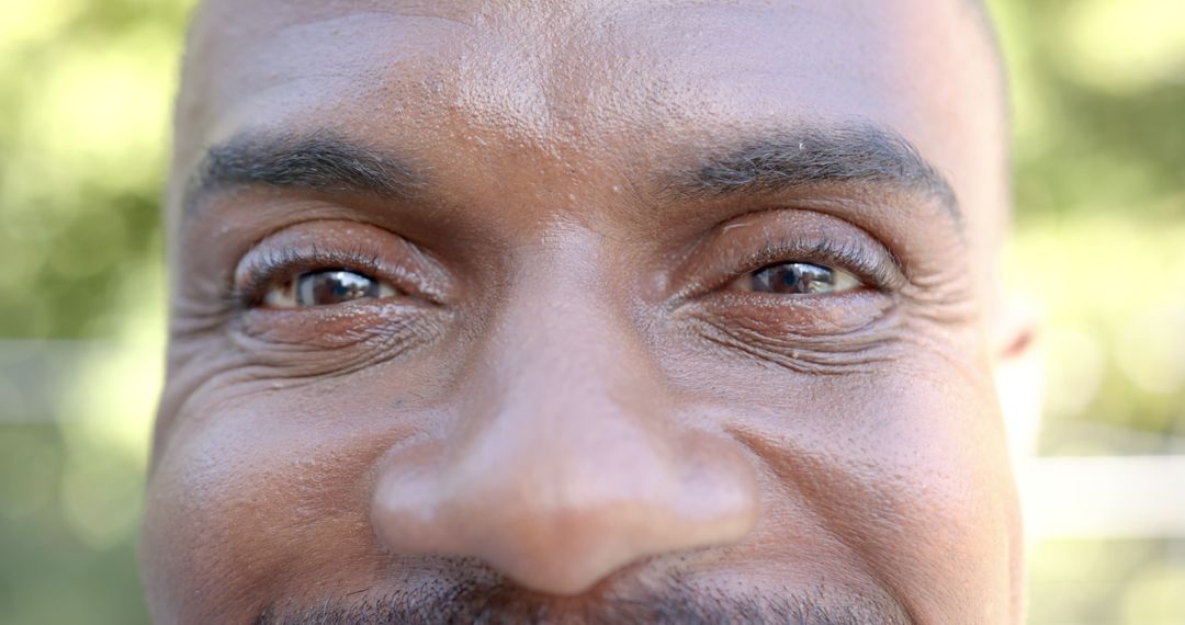 Close-Up of Elderly Man's Eyes and Smile Conveying Joy