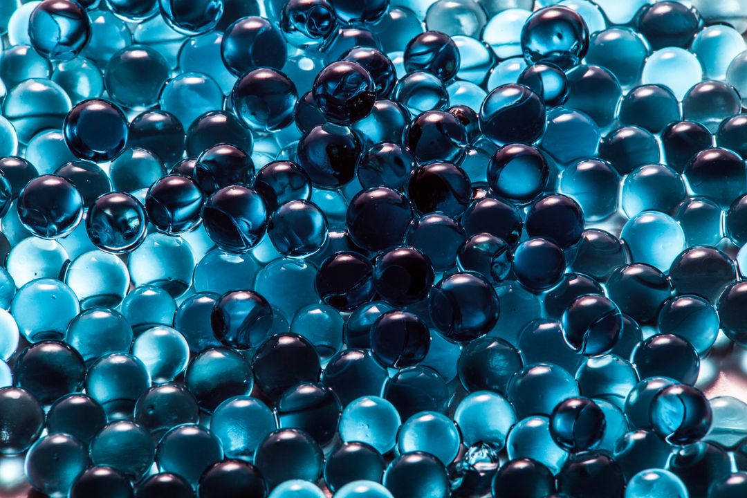 Closeup of Transparent Blue Gel Beads with Shiny Surface - Free Images, Stock Photos and Pictures on Pikwizard.com