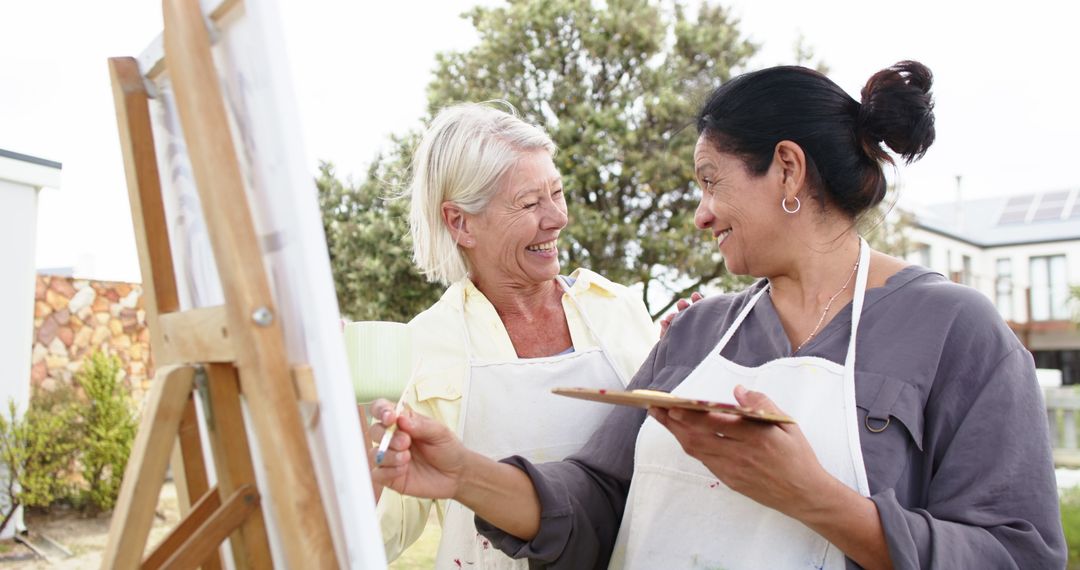 Smiling Senior Women Painting and Enjoying Art Outdoors - Free Images, Stock Photos and Pictures on Pikwizard.com