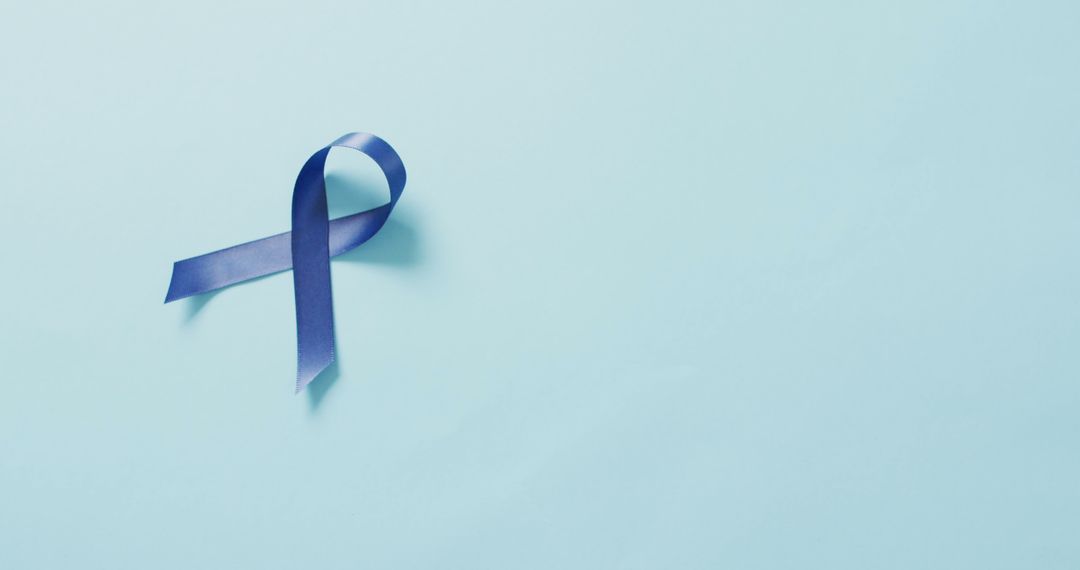 Purple Ribbon on Light Blue Background for Cancer Awareness - Free Images, Stock Photos and Pictures on Pikwizard.com