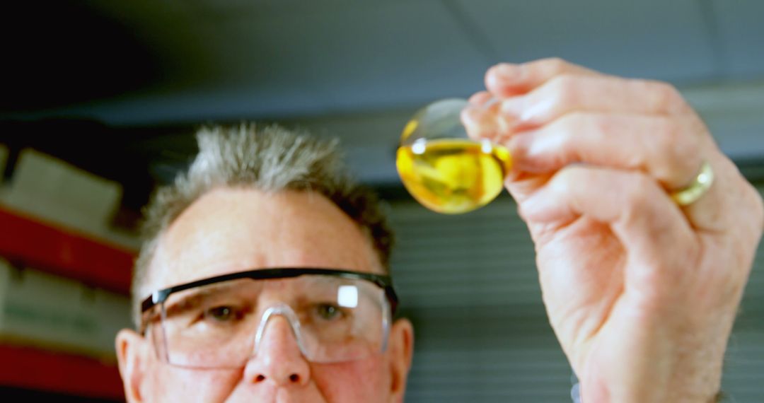 Scientist Examining Liquid in Test Tube - Free Images, Stock Photos and Pictures on Pikwizard.com