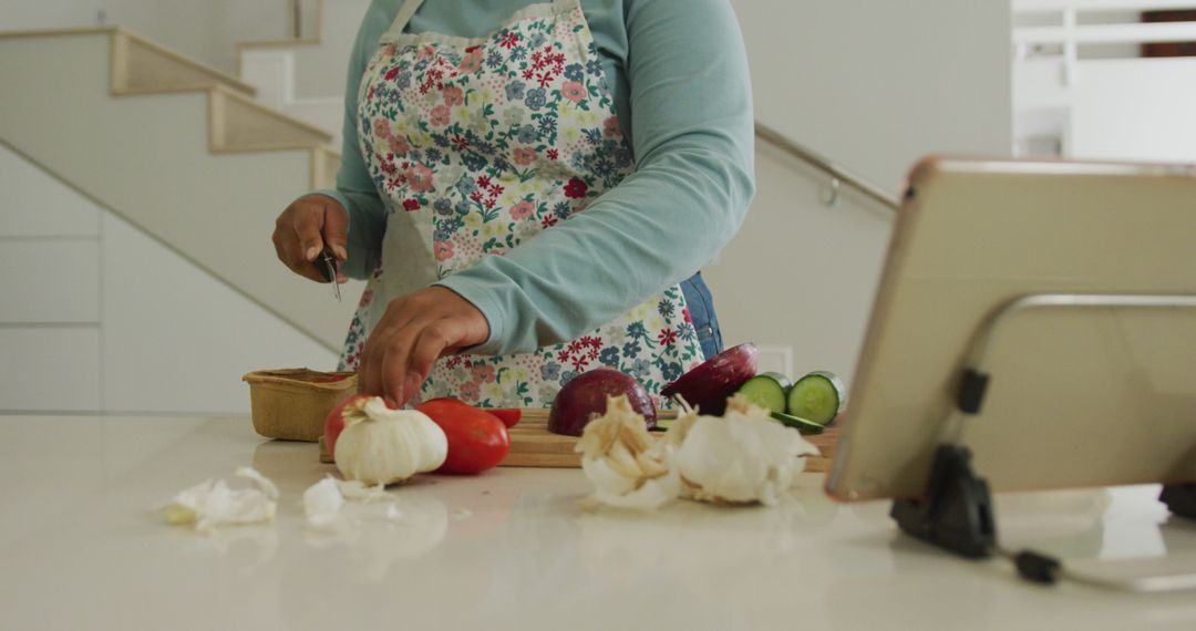 Woman Preparing Vegetables in a Modern Kitchen Setting - Free Images, Stock Photos and Pictures on Pikwizard.com