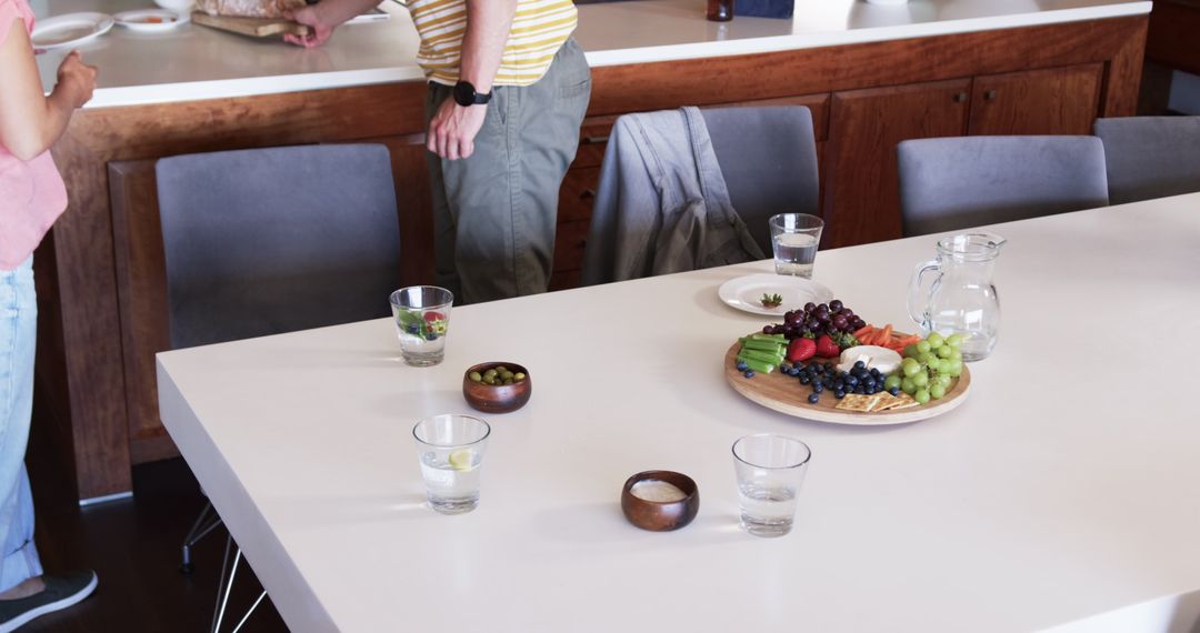 Casual Gathering With Fruit Platter on Modern Dining Table