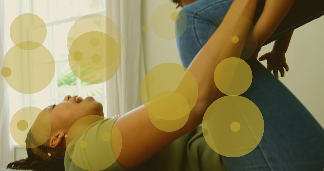 Father Playing with Baby During Weaning Week Celebration