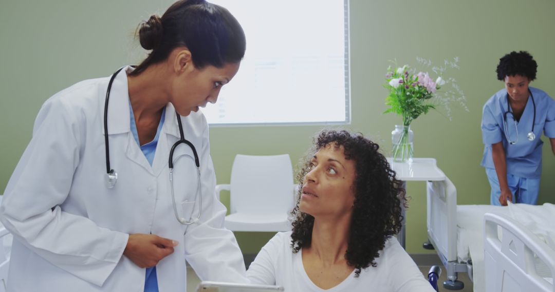 Doctor discussing diagnosis with patient in hospital room - Free Images, Stock Photos and Pictures on Pikwizard.com